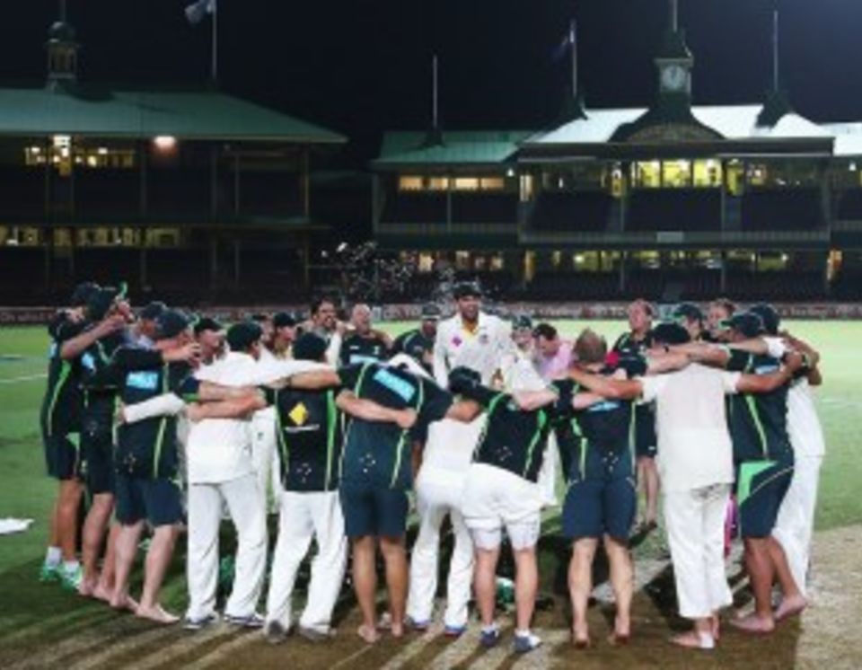 Nathan Lyon leads the team and coaching staff in a rendition of "Underneath the Southern Cross I Stand"