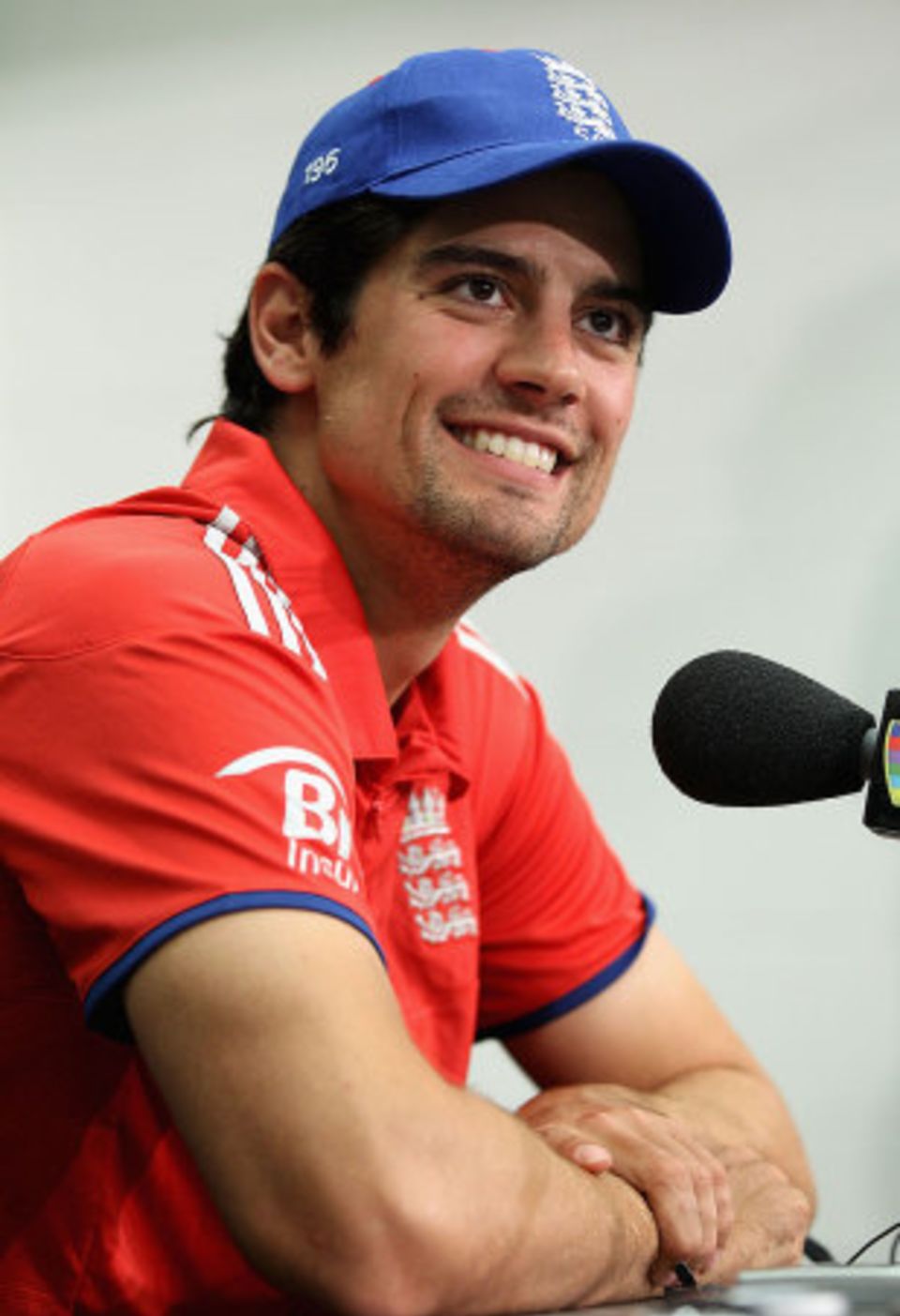 Laughing it off: Alastair Cook attempts to get through another inquisition
