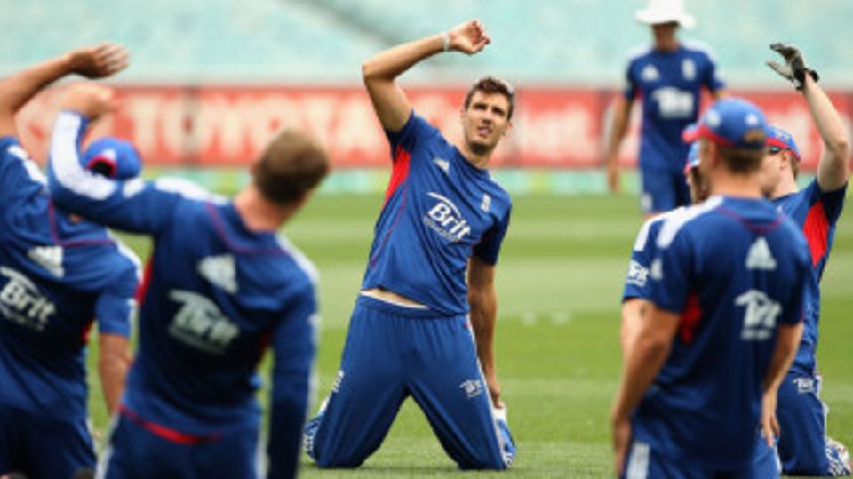 Hands up who wants to play some one-day cricket? Steven Finn takes part in a stretching exercise