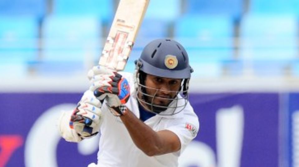 Dimuth Karunaratne drives during his half-century