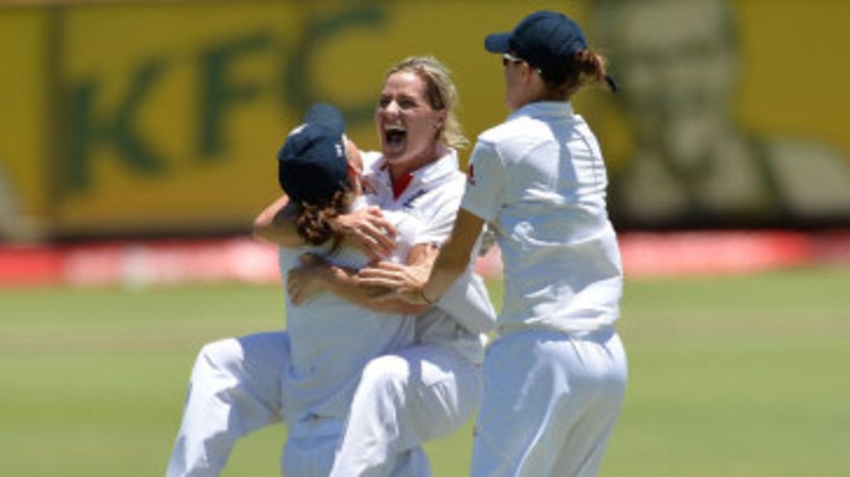 Katherine Brunt jumps on her team-mate after taking a wicket