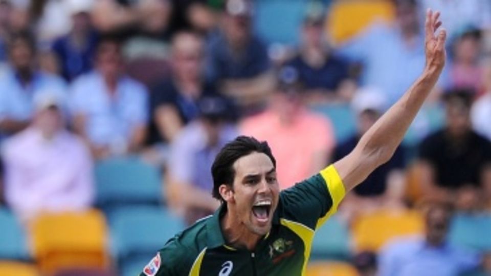 Mitchell Johnson celebrates having Joe Root trapped lbw