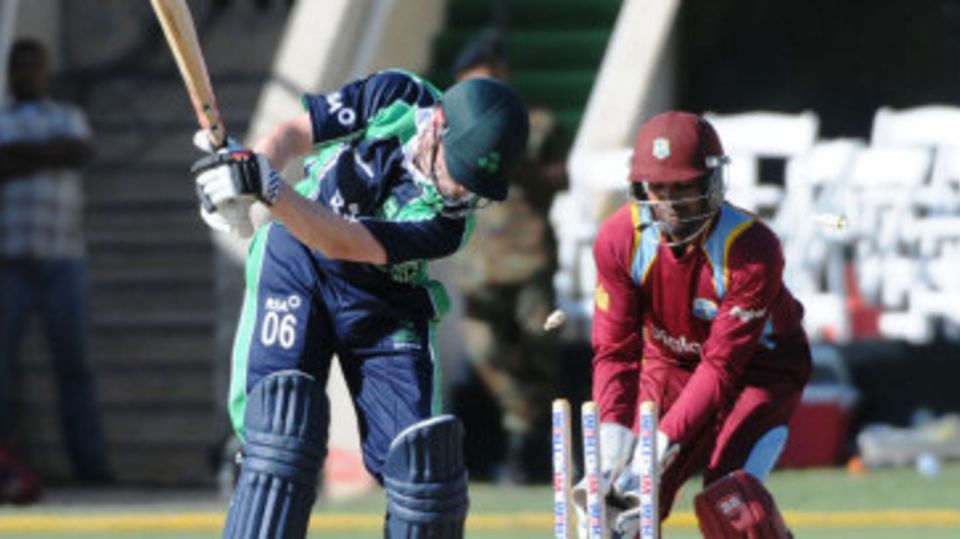 William Porterfield is bowled by Samuel Badree