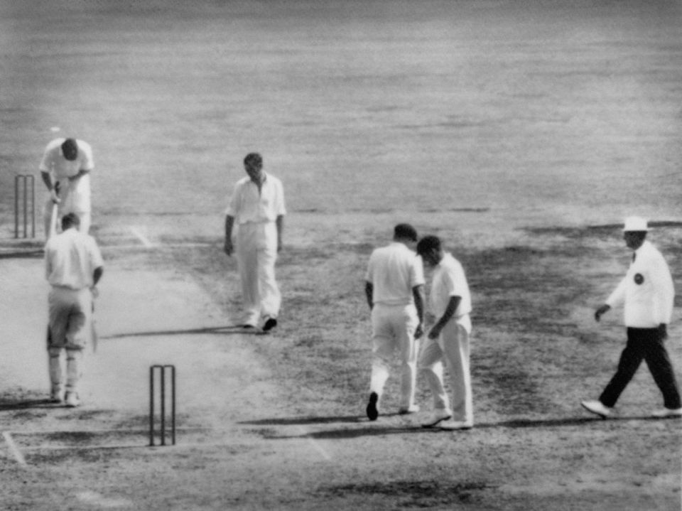 Death knell: A dejected Meckiff stares at the pitch after being no-balled at the Gabba