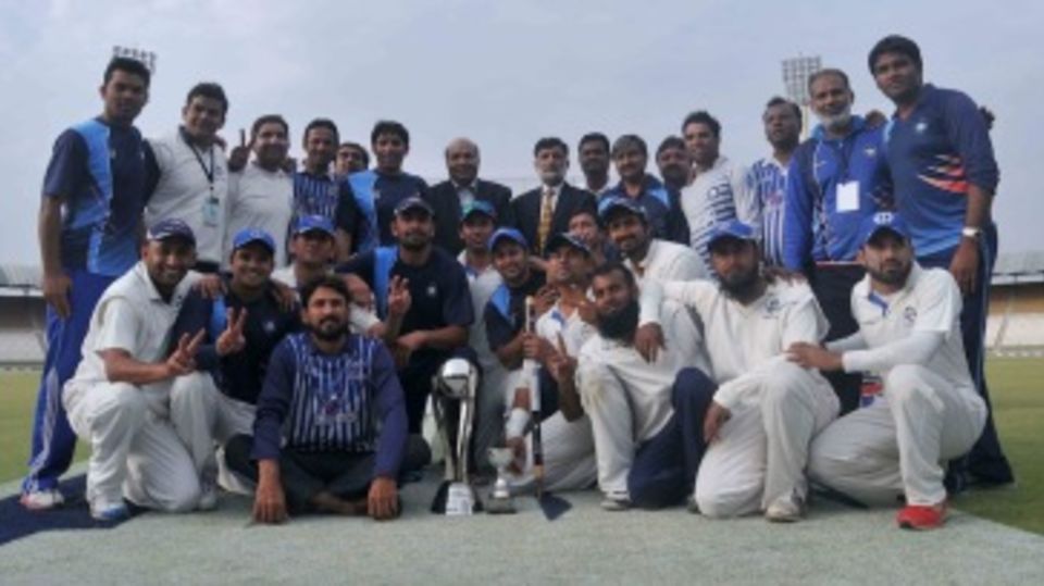 The SNGPL players pose with the trophy
