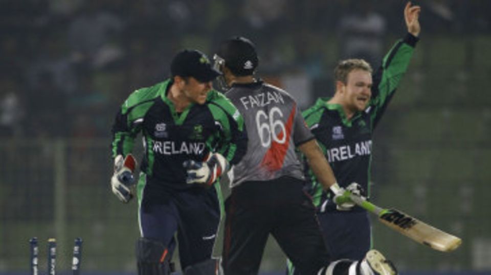 Gary Wilson and Paul Stirling celebrate Faizan Asif's run-out
