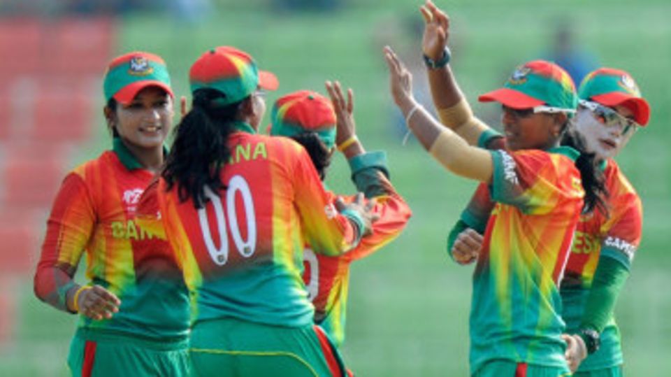 The Bangladesh team celebrate the fall of Sarah Taylor's wicket