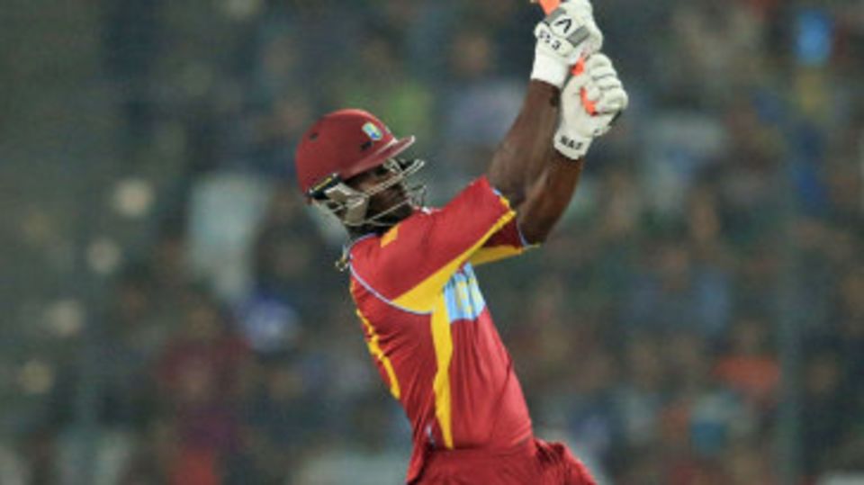Darren Sammy lofts the ball down the ground