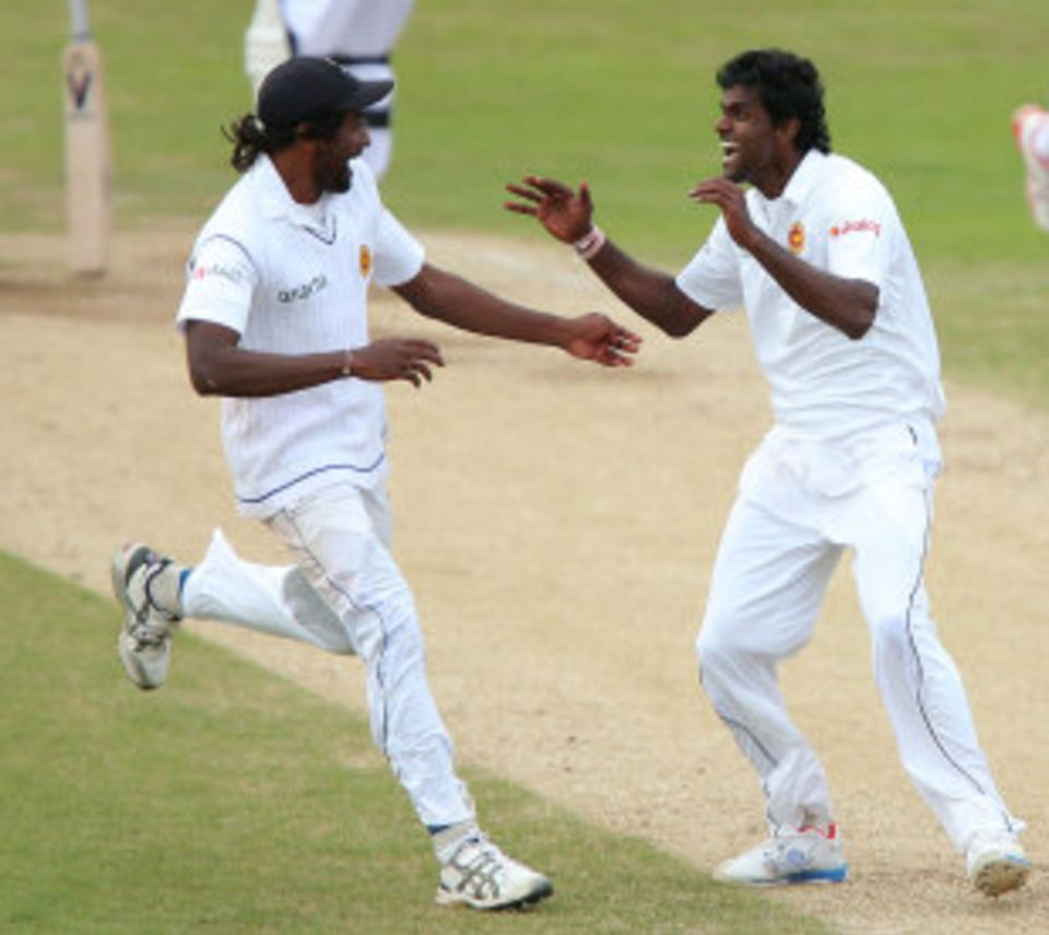 Sri Lanka's fast-bowling competition finds, Nuwan Pradeep and Shaminda Eranga, celebrate victory