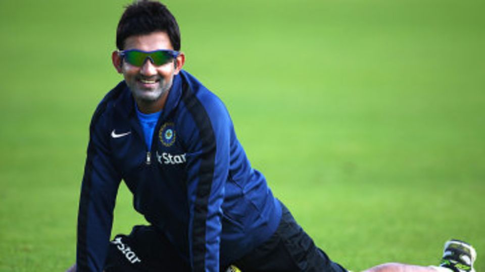 Gautam Gambhir stretches during a training session