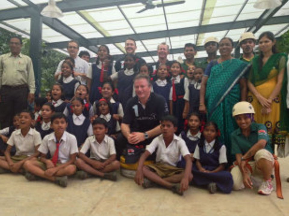 Steve Waugh with children at the Magic Bus Learning and Development Centre
