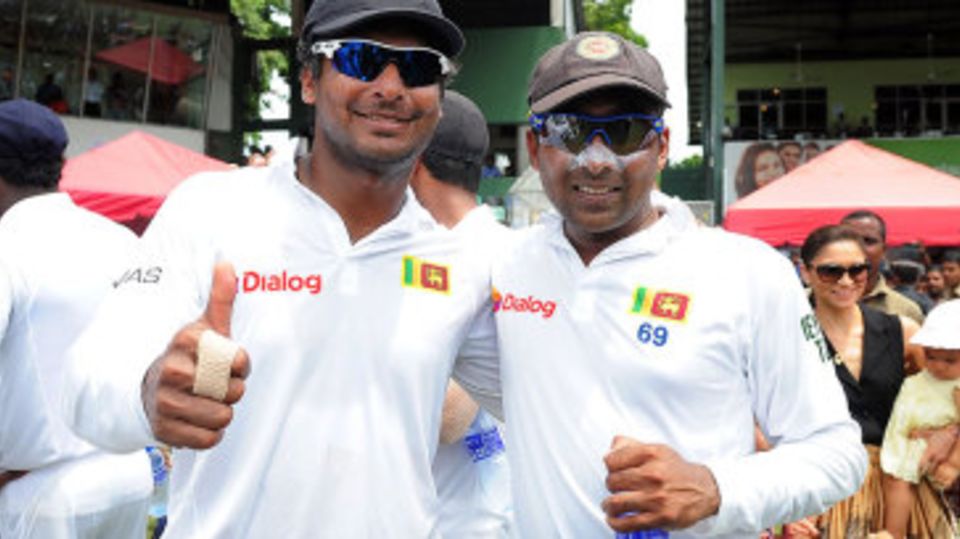 Kumar Sangakkara and Mahela Jayawardene pose for one last photo in whites