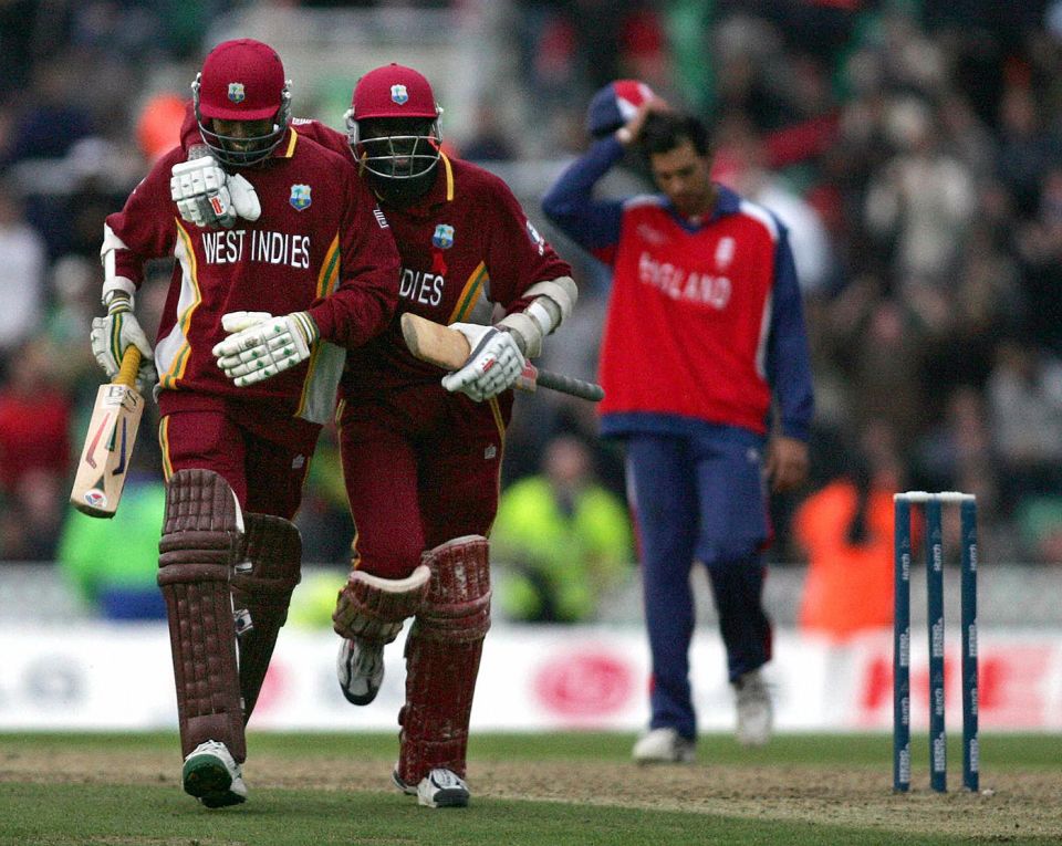 B is for basking in the pleasure of a hard-fought win: Ian Bradshaw and Courtney Browne walk back after clinching the Champions Trophy