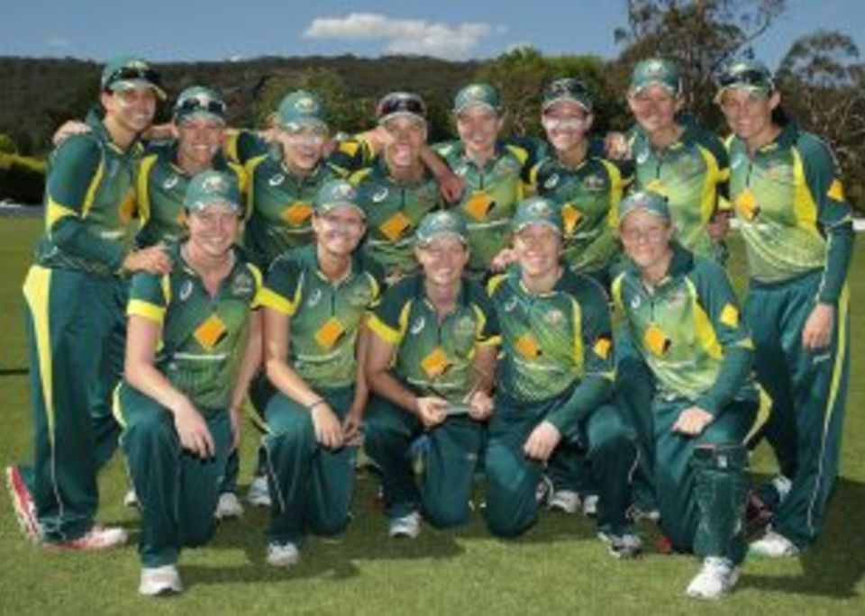 The victorious Australia Women's team with the trophy