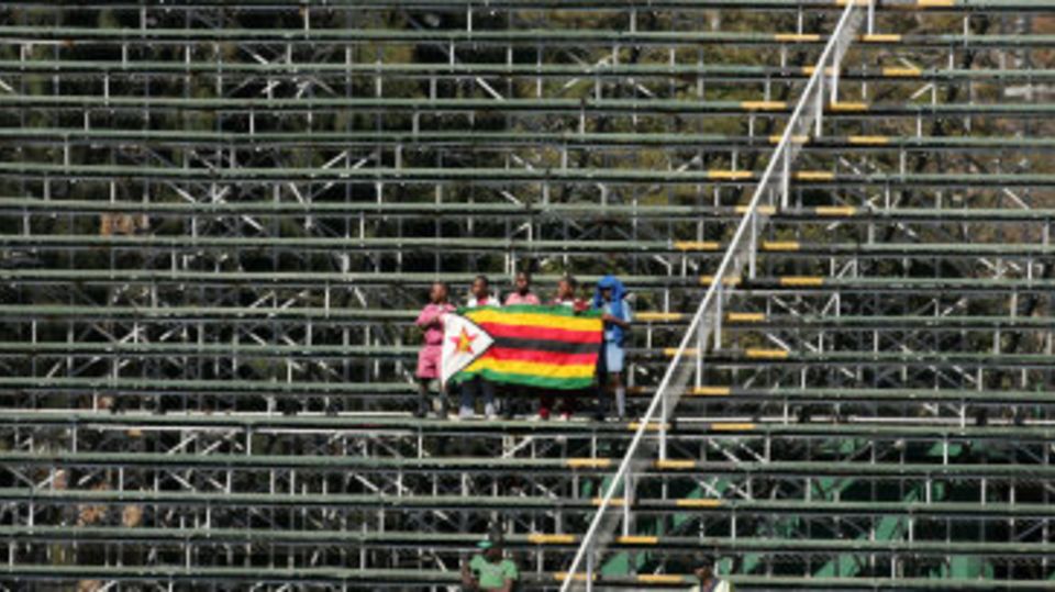 Zimbabwe fans hold up the flag