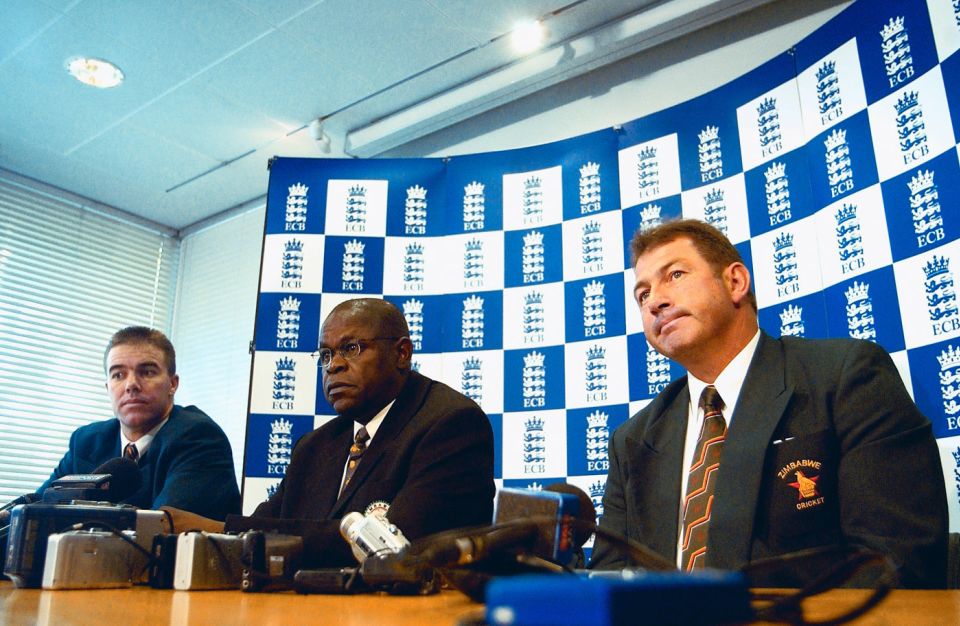 Man in the middle: at times Peter Chingoka (centre) appeared powerless in the tussle between the players and Ozias Bvute