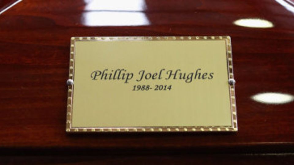 The coffin of Phillip Hughes seen inside the Macksville High School stadium