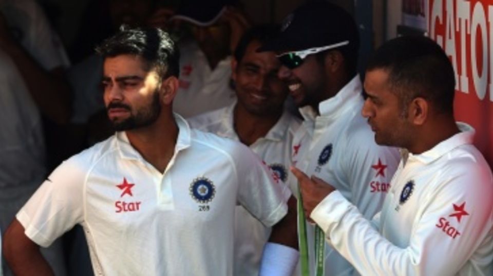 Virat Kohli and MS Dhoni chat before the start of play