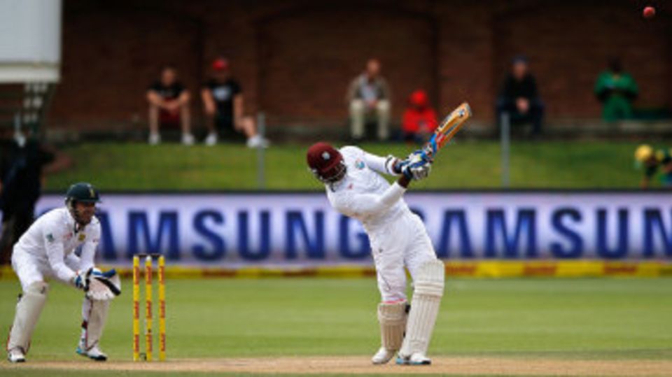 Marlon Samuels launches the ball over the top