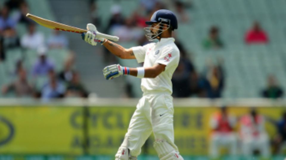Virat Kohli celebrates his half-century