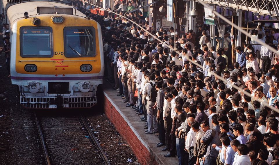 Crush hour: crowds wait at a Mumbai rail station; not too long ago, Rahane was among them