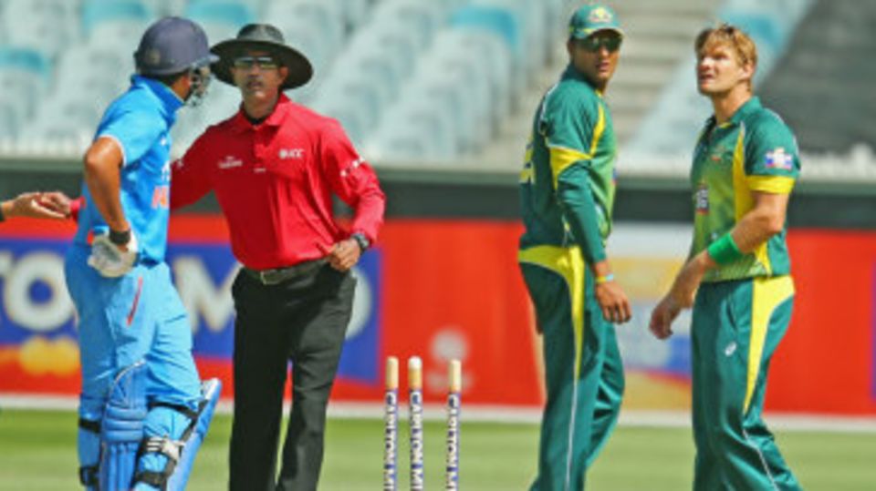 Rohit Sharma and the Australian fielders exchange a few words