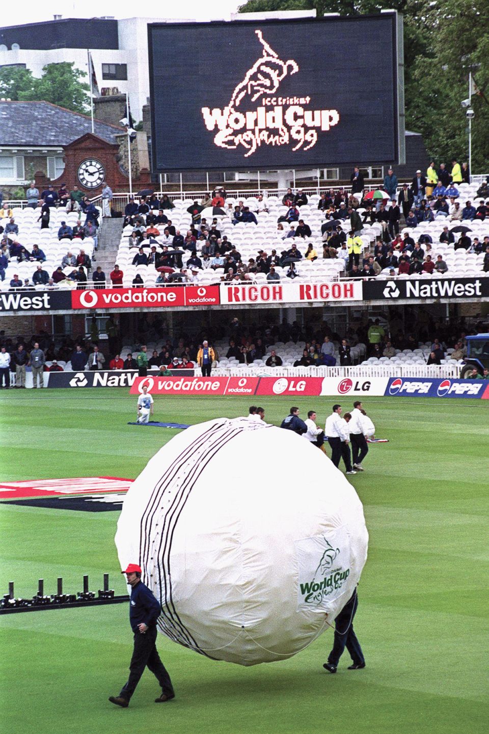 Rock n'roll it wasn't: a giant cricket ball filled with balloons is carried on to the field for the opening ceremony