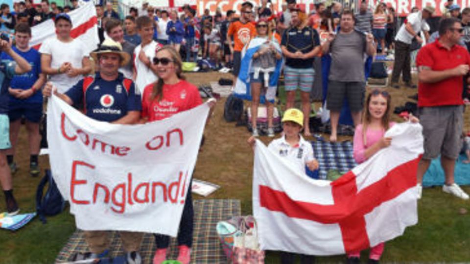 England fans cheer from the grass banks of the Hagley Oval