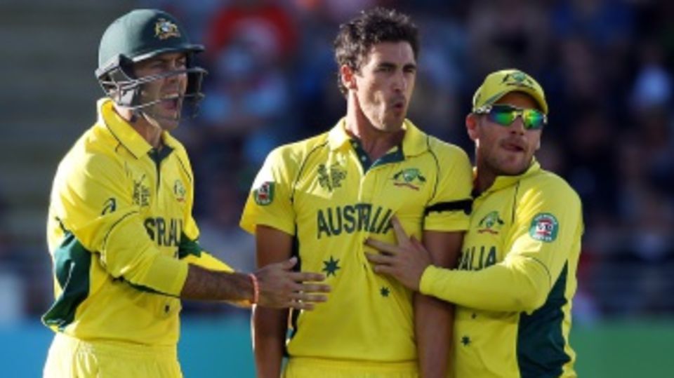 Mitchell Starc is flanked by Aaron Finch and Glenn Maxwell after striking twice in two balls