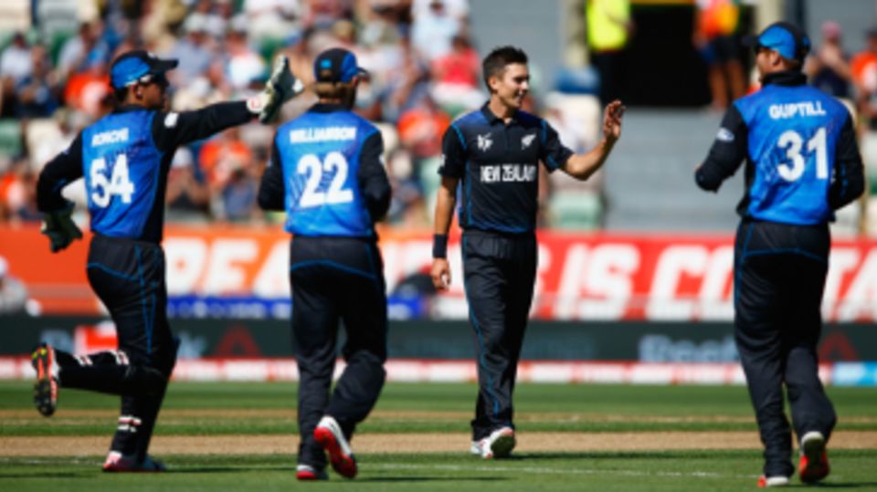 New Zealand gather around Trent Boult after an early wicket