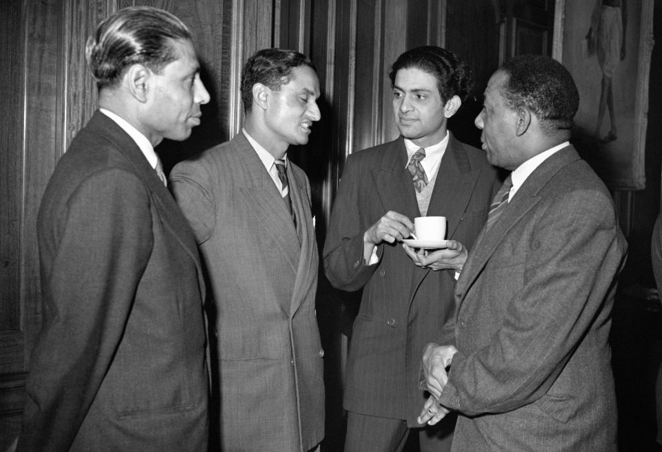 Hazare (second from left) talks to West Indies' Learie Constantine at a party during the 1952 tour of England