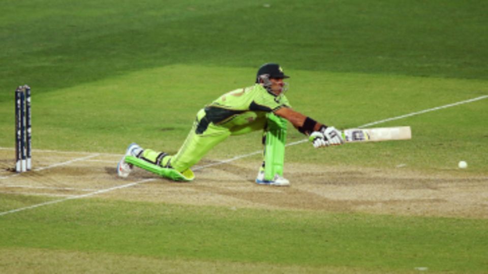 Misbah-ul-Haq stretches out for a reverse sweep