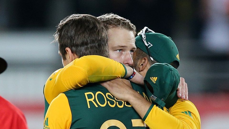 David Miller is embraced by his team-mates after coming up short