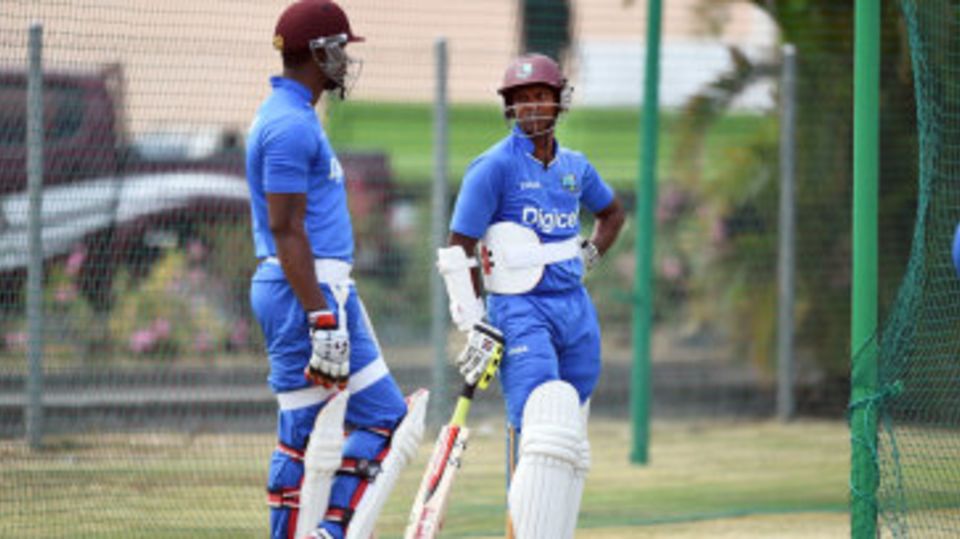 Marlon Samuels and Shivnarine Chanderpaul wait to bat