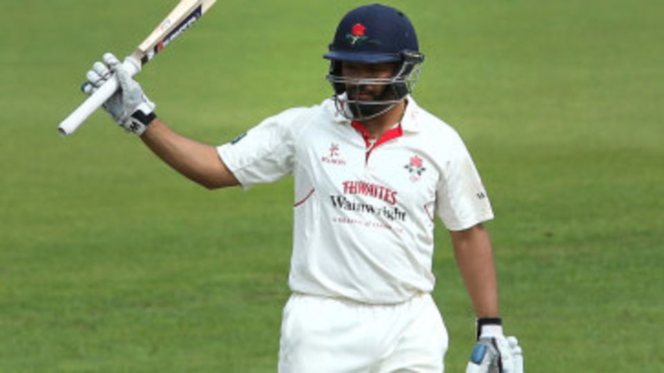 Ashwell Prince raises his bat for his fifty