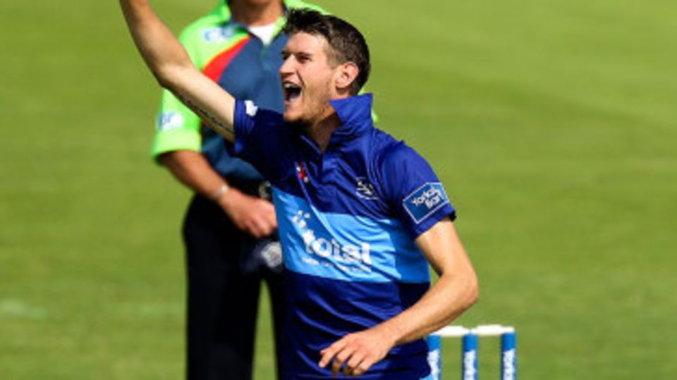 David Payne celebrates a wicket