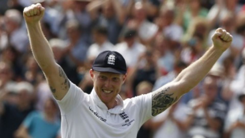 Ben Stokes has his hands aloft in delight