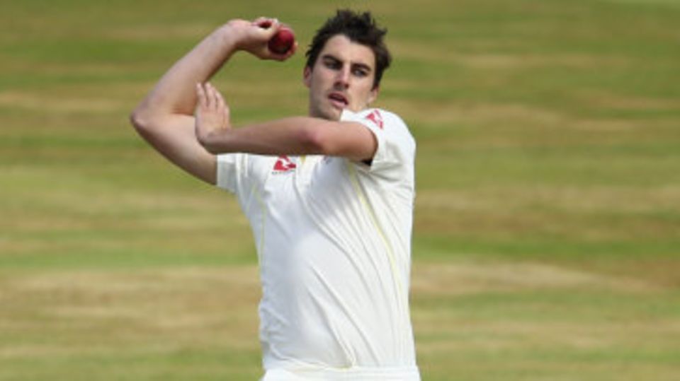 Pat Cummins launches into his delivery stride