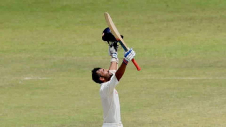 Ajinkya Rahane looks skyward after completing his century