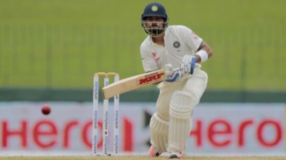 Virat Kohli drives the ball through the off side