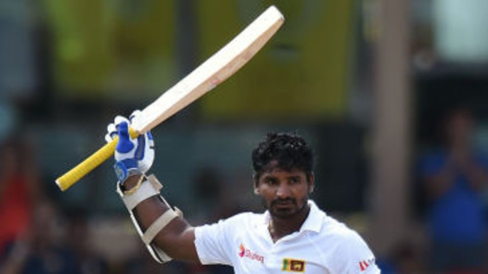 Kusal Perera raises the bat after his maiden Test fifty