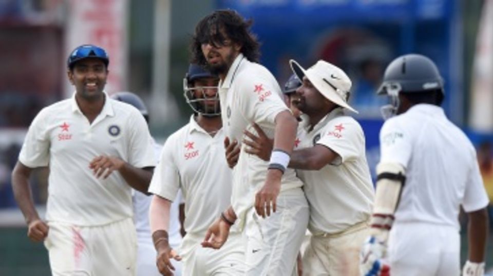 Ishant Sharma is mobbed by his team-mates