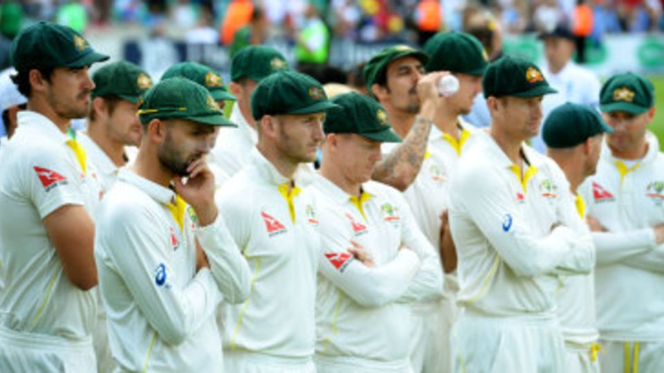 Australian players watch England's celebrations