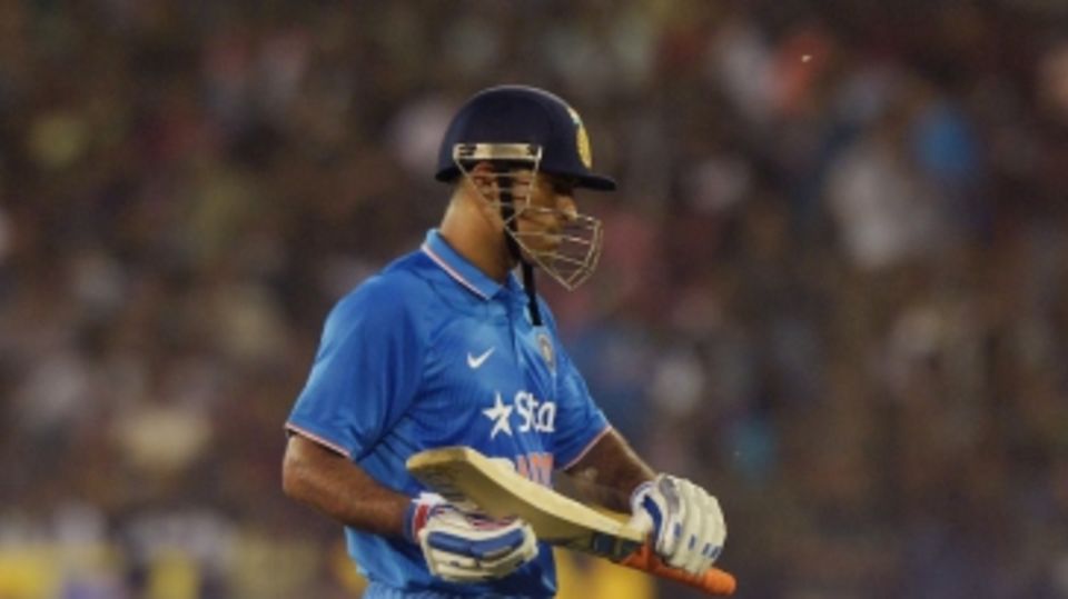 MS Dhoni walks back after scoring 5