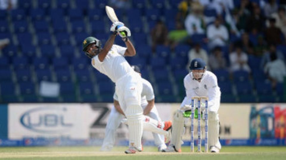 Asad Shafiq drives down the ground during his century