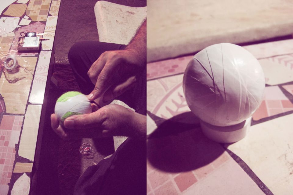 Caught on tape: a tennis ball is readied for a night match