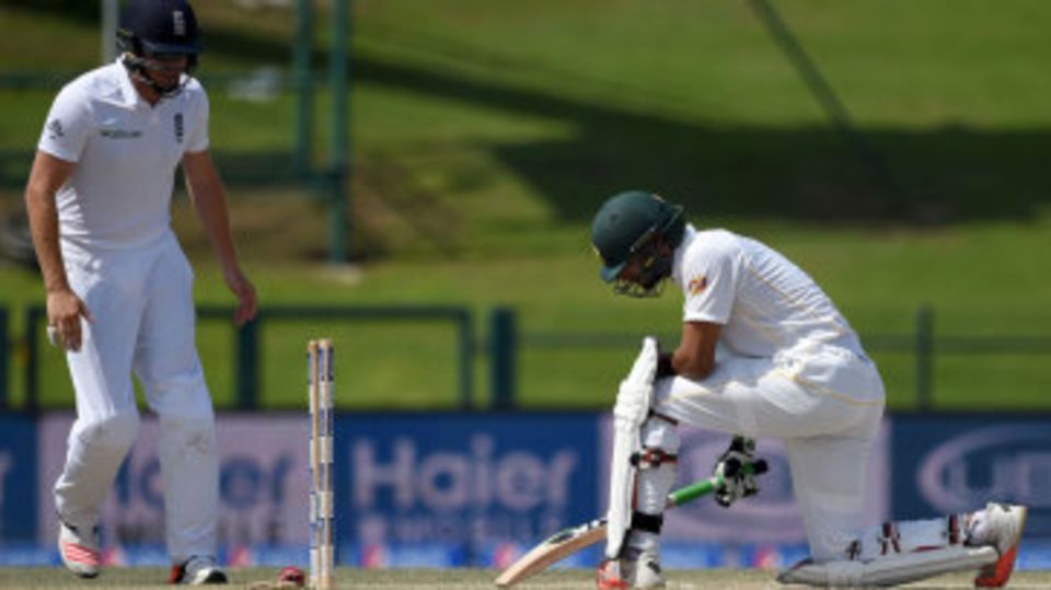 Shan Masood can't prevent the ball rolling back into his stumps