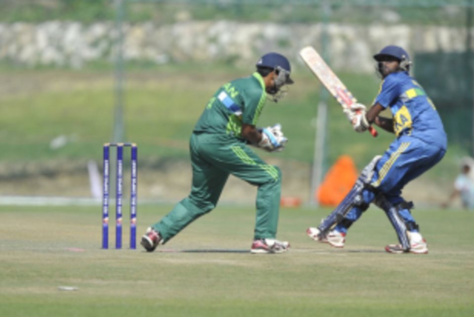 Improvisation on display: An ICBT batsman lifts the ball over the Jinnah Degree College wicket keeper