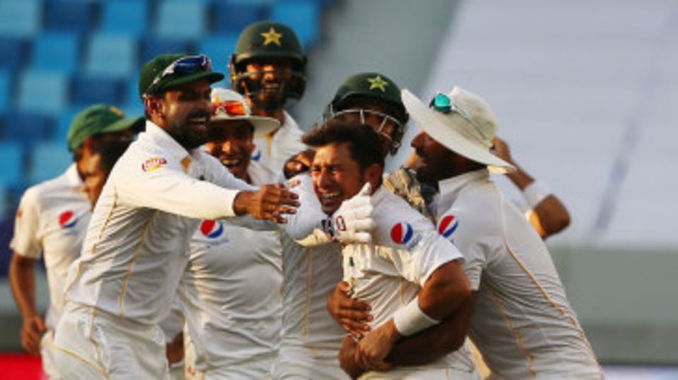 Pakistan's fielders mob Yasir Shah after Pakistan's thrilling win