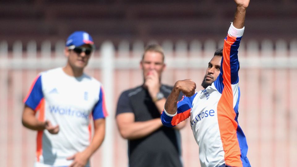 Adil Rashid bowls in the nets at Sharjah, watched by Alastair Cook and Shane Warne